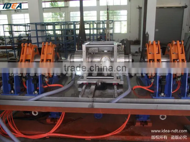 Rotary ultrasonic testing system for high speed tube testing directly in the production line