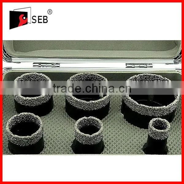 Vacuum brazed reinforced diamond core drill bits