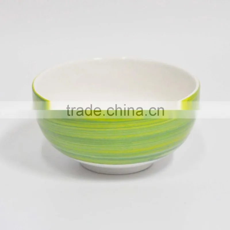 Baby feeding small ceramic rice bowl with colorful painting