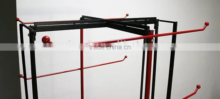 Red metal hanging bag display stand