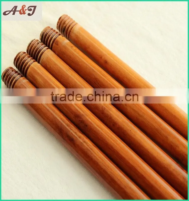 varnished wooden broom handle with long hanger