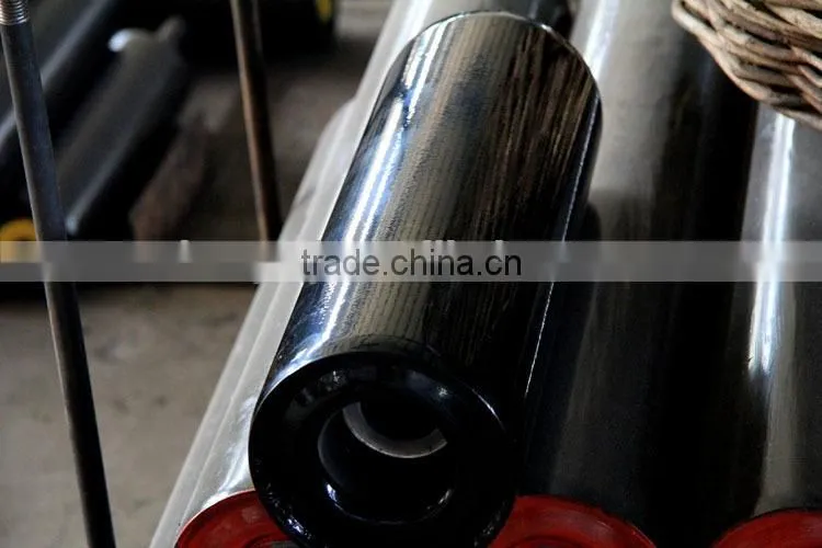 Heat resistant material conveyor trough idler roller