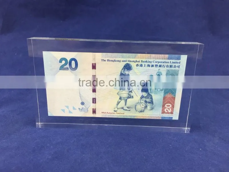 transparent plastic acrylic logo block with money