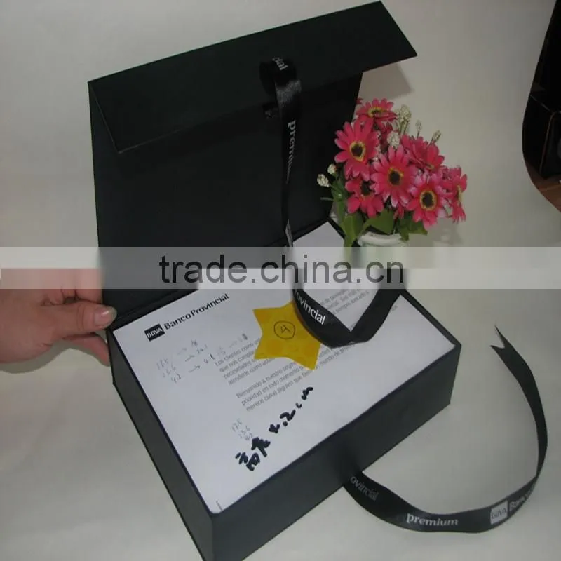 black box with CMYK printing and gold logo lamination and ribbon