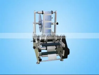 Manual round bottle labeling machine