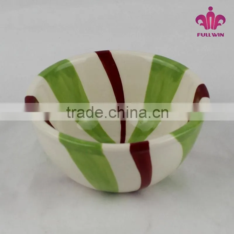 Colorful ceramic bowl with candy stripe design