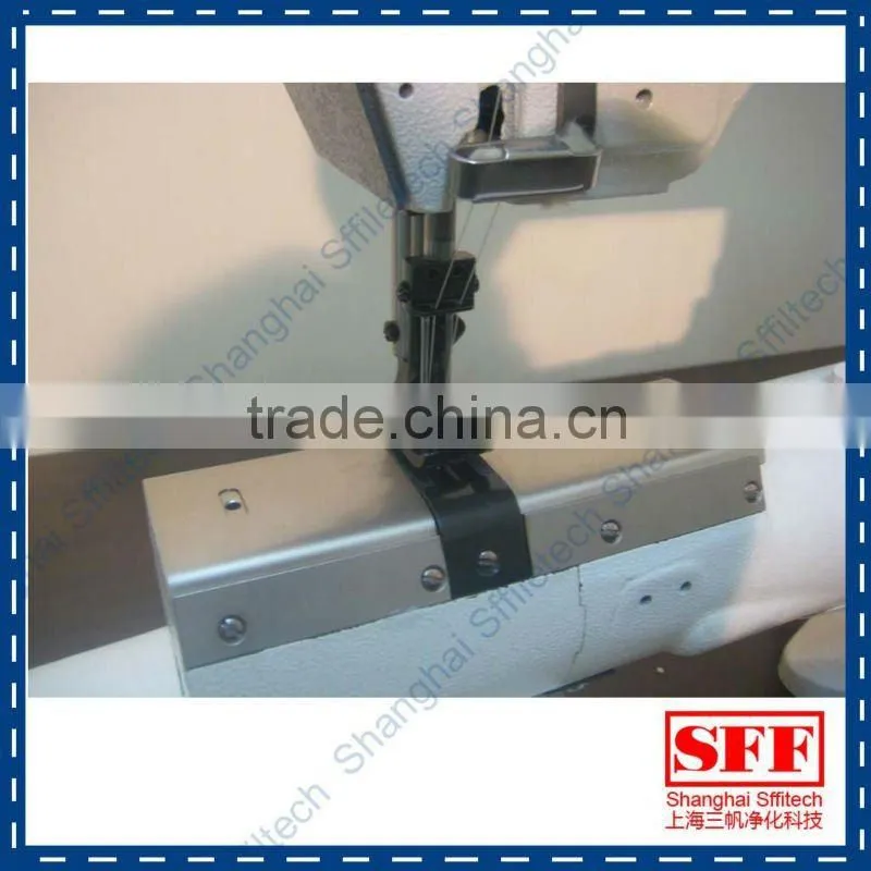 Short arm sewing machine for top and bottom of filter bag