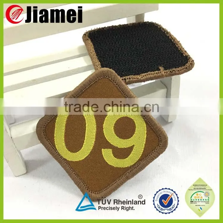 Factory cheap made woven patches with safety pin