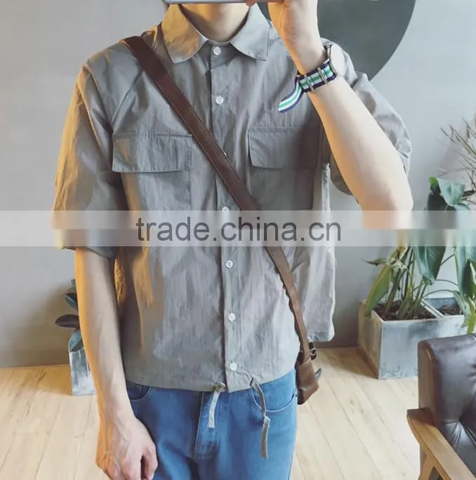 Loosely contracted pocket short sleeve shirt