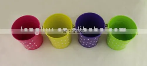 small colorful metal pail with handle