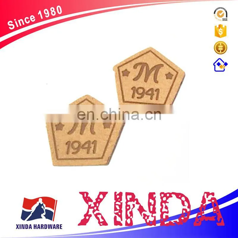 small labels with customized embossed design, small leather patches