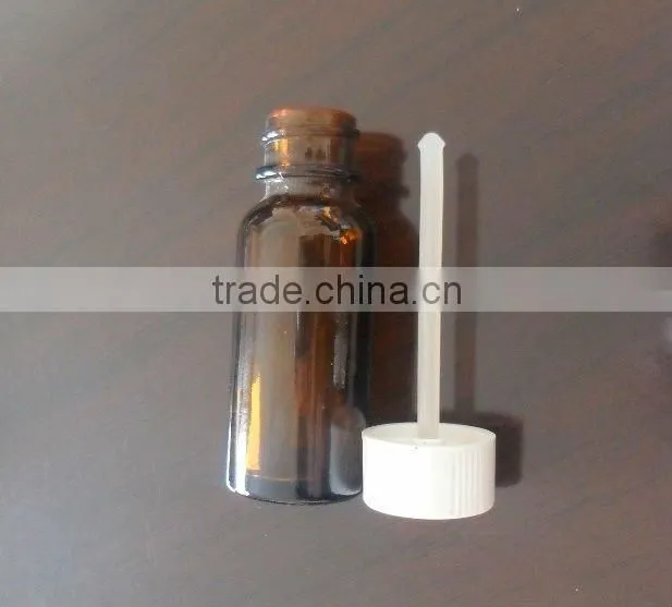 18/400 neck size amber bottle with white UF bakelite cap spatula rod cap