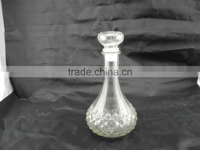 sealed clear glass drinking bottle with glass cork lid