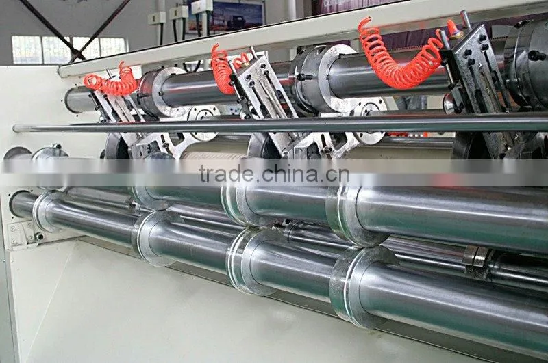 Automatic corrugated paperboard slitting scorer