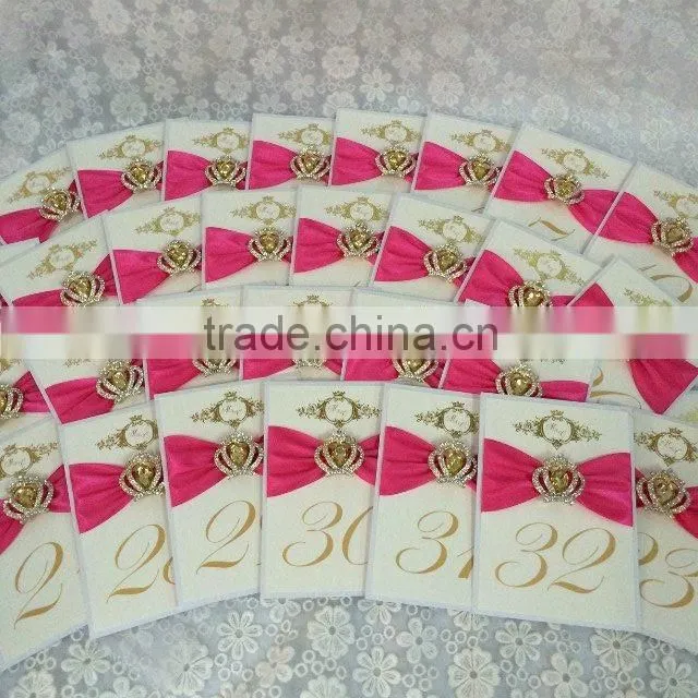 fold tablenumber with matching ribbon of invitationswedding invitations table