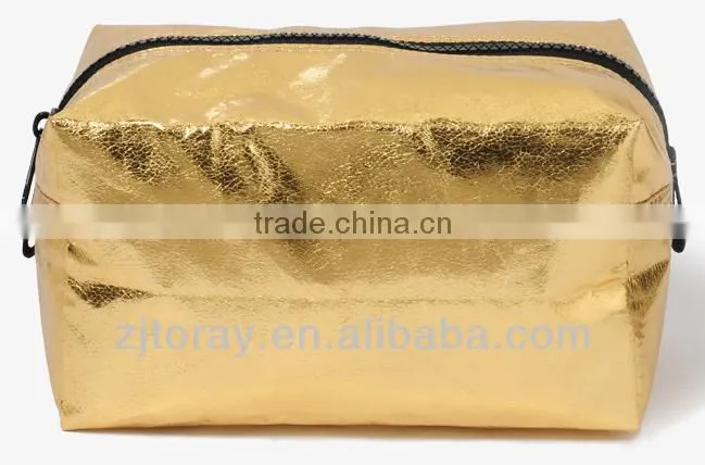 Fully lined distressed metallic cosmetic bag featuring a contrast zipper