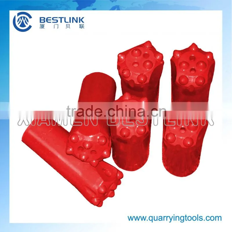 Rock drilling button bit