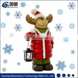 Regal Santa statue and Sledding Santa Figurine