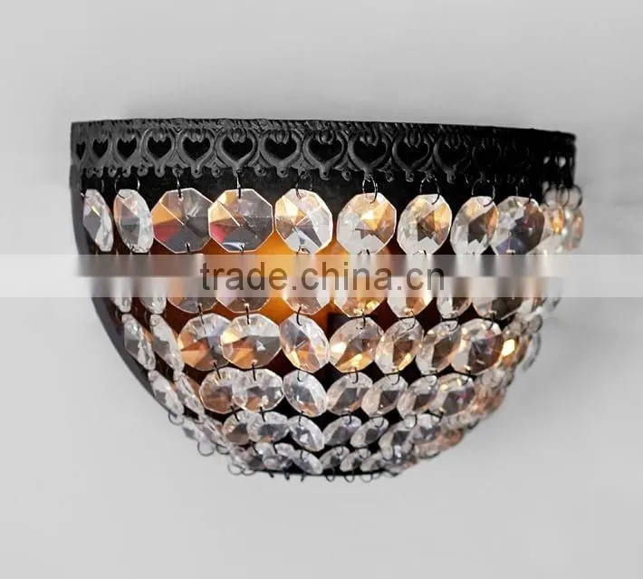 0108-6 antique bronze base is embellished with decorative detailing Cascading faceted glass crystals sparkle sconce