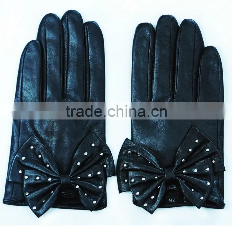 stylish black studded gloves in a big bow