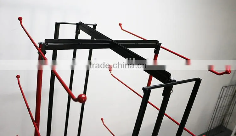 Red metal hanging bag display stand