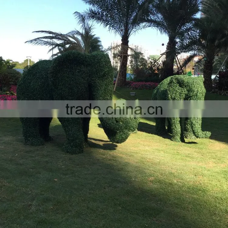 Fiberglass elephant sculpture with artificial grass