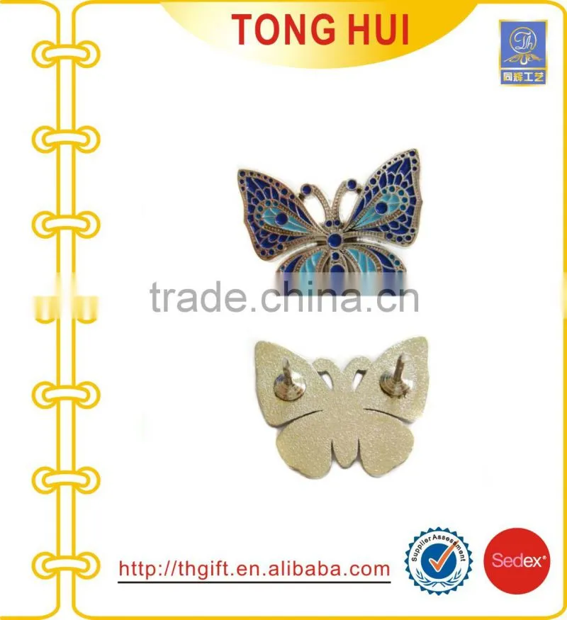 Metal badges with fan-shaped design