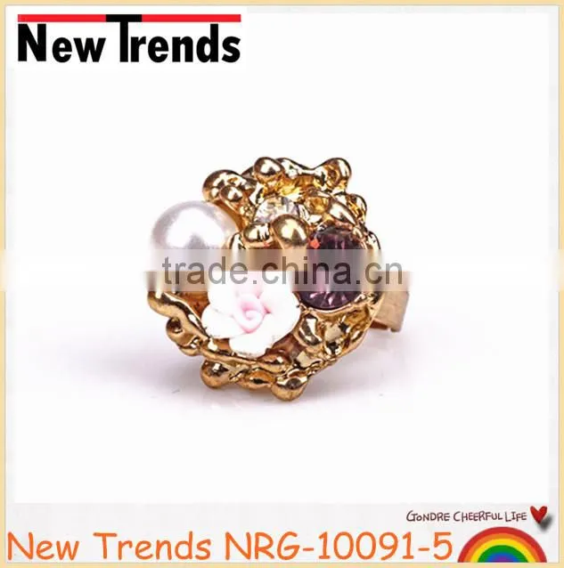 Fancy flower pearl gold ring designs with large crystal