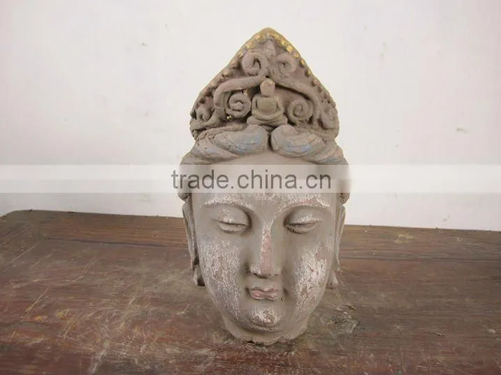 hand carved mud buddha head