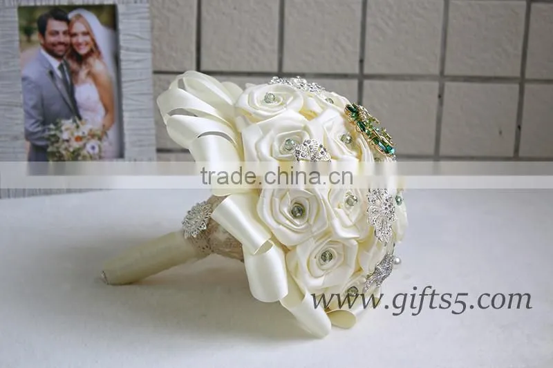 Romantic wedding bouquet full of crystal beads and green brooches