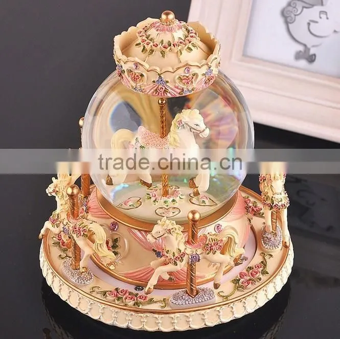 Exclusive resin carrousel rotate LED music snow globe
