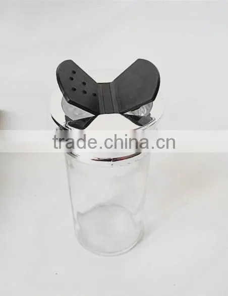 small clear glass paragon spice jars with butterfly cap