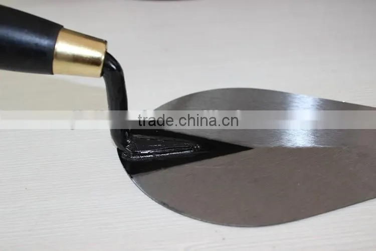 Bricklaying trowel with wooden handle
