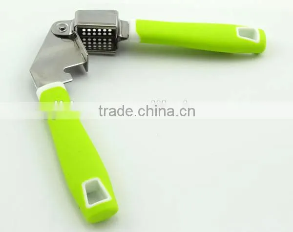easy to use and clean stainless steel garlic press with soft handle