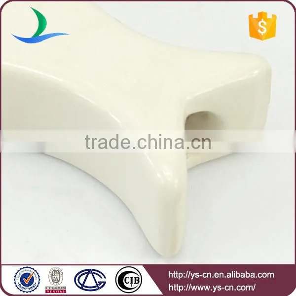 white fish hanging with two thread hole