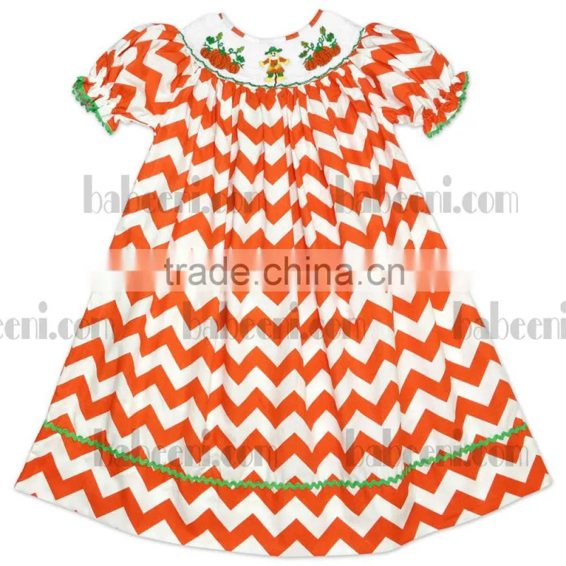 Cute pumpkin truck hand smocked bishop dress