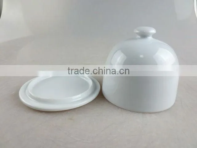 white porcelain bell-shaped butter dish with lid