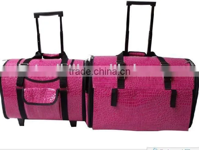 Pink PU trolley pet carrier Pink PU trolley pet carrier with wheels and a bar