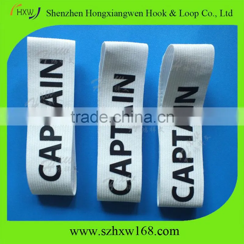 Adjustable captain arm band with hook and loop closure