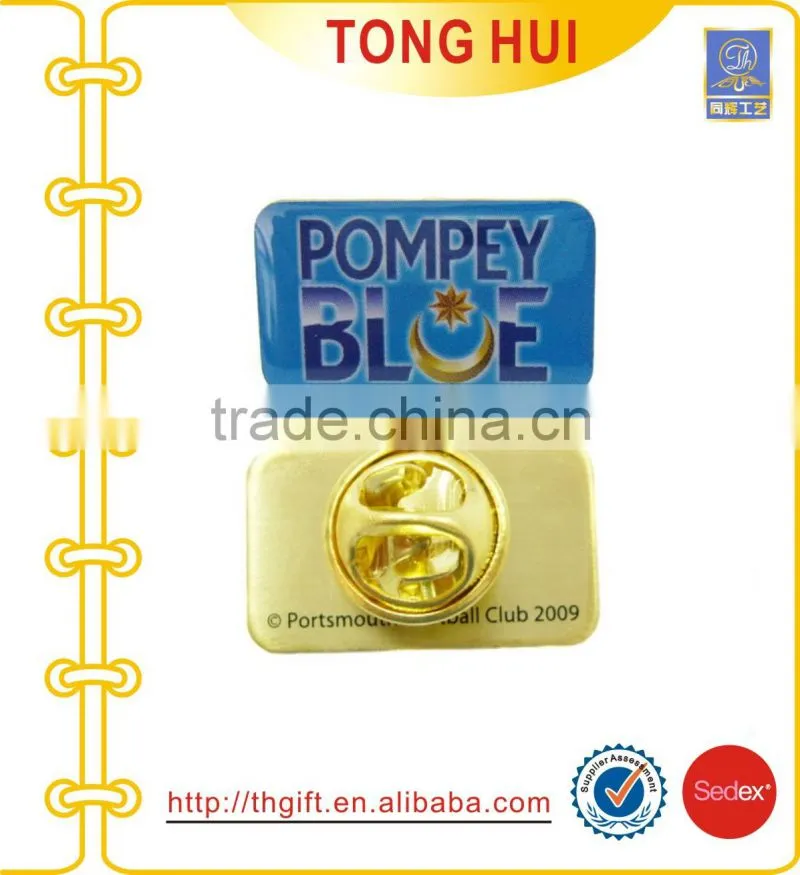 Metal badges with fan-shaped design