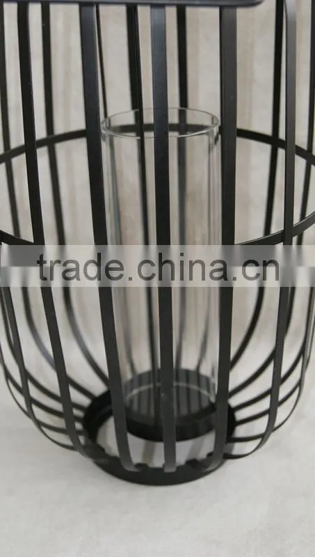 large metal lantern with clear glass cylinder