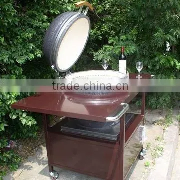 Holland Clay charcoal egg bbq grill with brown iron table