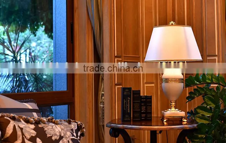 Graceful white color jade body brass bottom home use table lamp with fabric lampshade