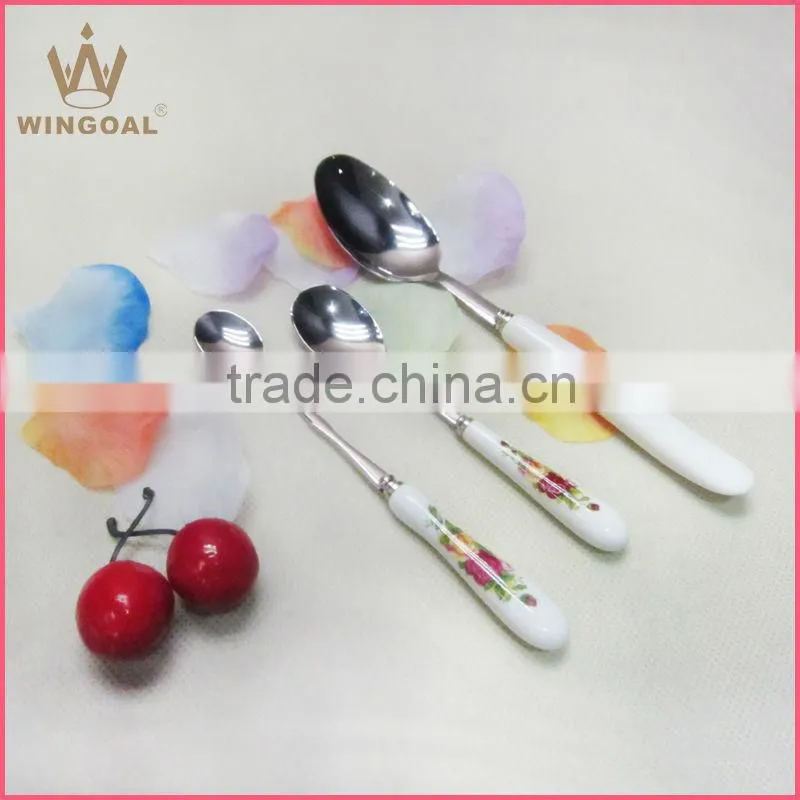Stainless spoon with porcelain handle