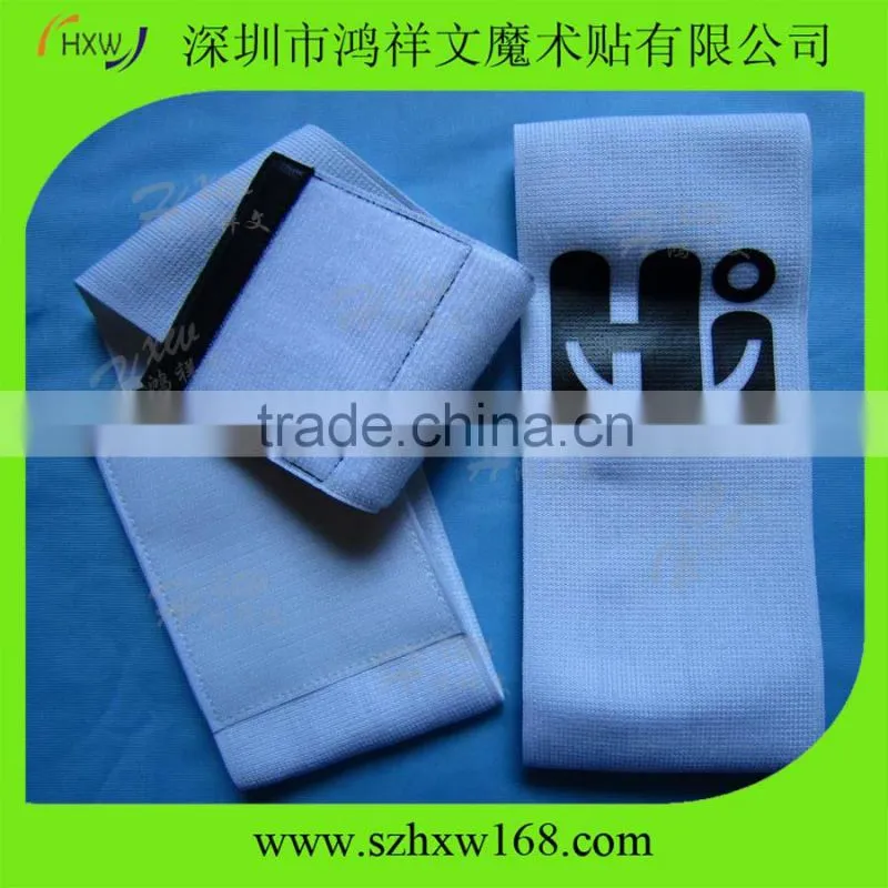Adjustable captain arm band with hook and loop closure