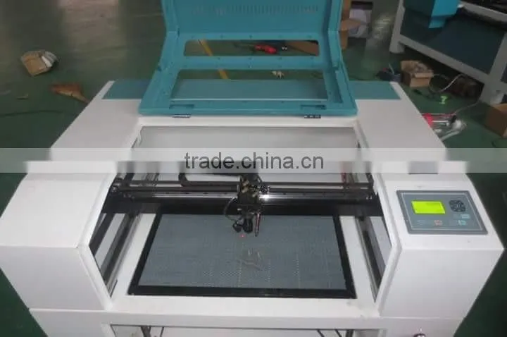 6090 laser engraver speedy 100 price co2 laser engraving cutting machine 40w with up and down platform