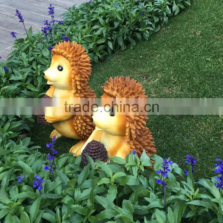 Polyresin squirrel figure in garden
