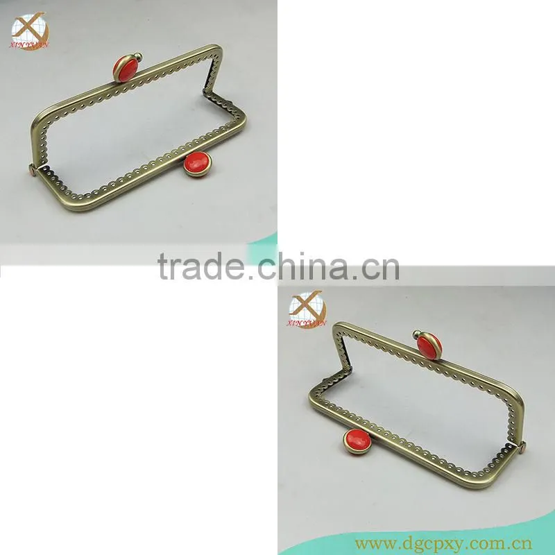 small metal purse frame with whirte gems