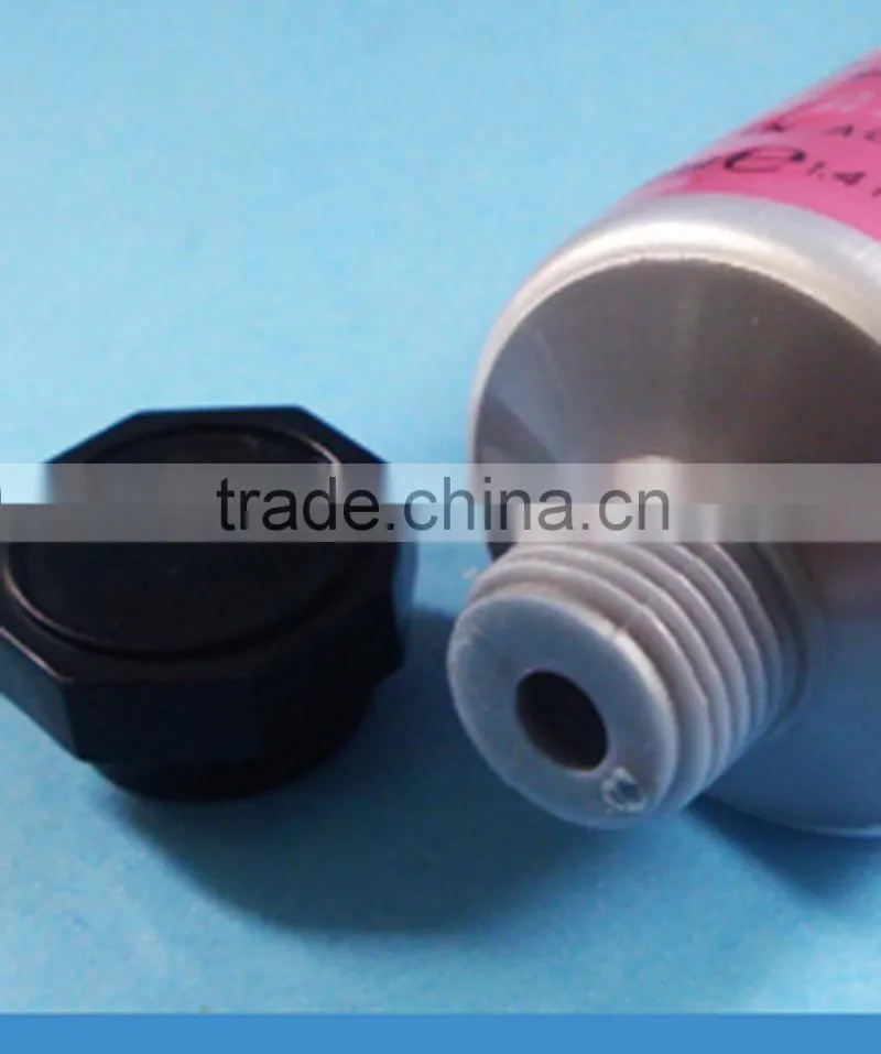Cosmetic tube with silicone valve flip top