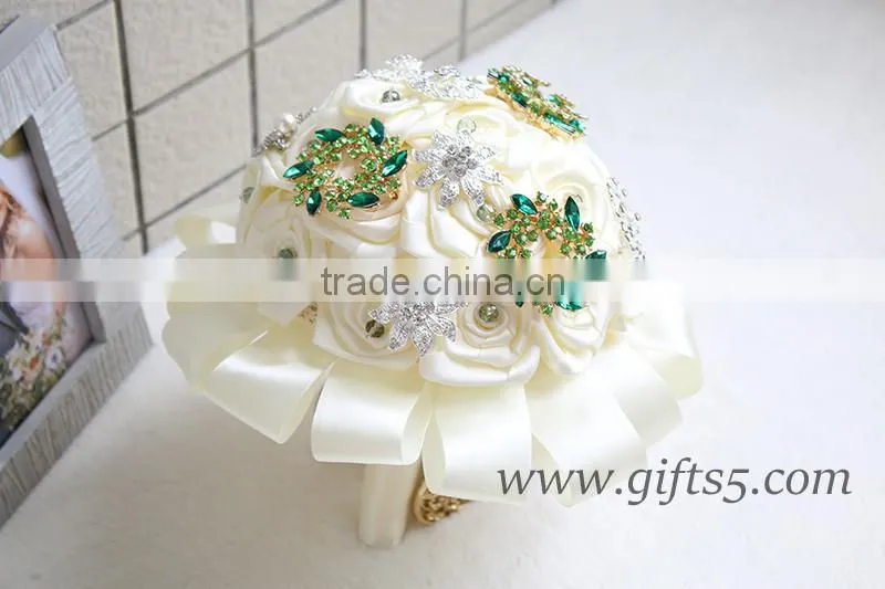 Romantic wedding bouquet full of crystal beads and green brooches